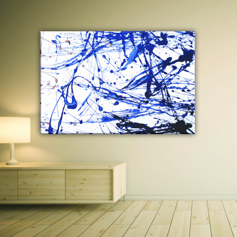 Tableau jets de couleurs abstrait. Bonne qualité, original, accrochée sur un mur au dessus d'une table dans un salon.